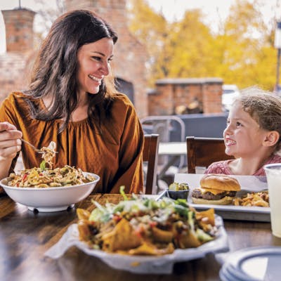 An image of mother and daughter eating at Streetside 62