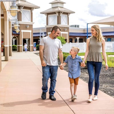 An image of a family shopping at Destination Outlets